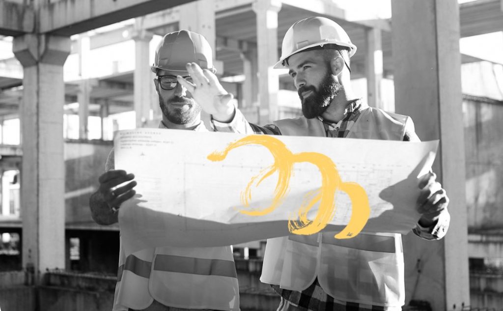 Two-Guys-Looking-At-Construction-Blueprint